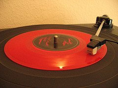 Red vinyl record on a turntable